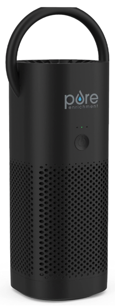 Portable air purifier by Pure Enrichment, featuring a cylindrical black design with perforated vents, a top handle, and a power button beneath the "Pure Enrichment" logo.