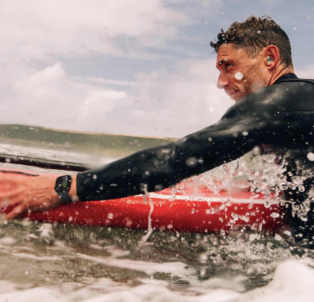 Apple Watch Series 9 worn by surfer, tracking activity while paddling in water