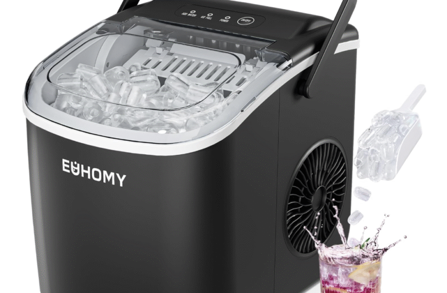 Euhomy Countertop Ice Maker in black with scoop and bullet ice, next to a glass of iced drink.