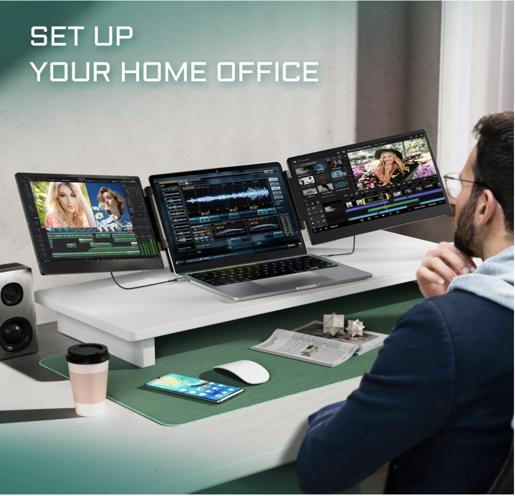 Man working at a desk with the Teamgee 14-inch laptop screen extender in triple-screen setup, showing video editing and multitasking for a home office workspace.