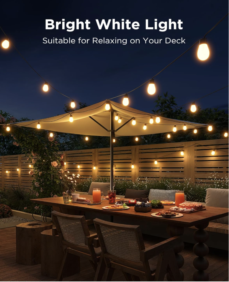 Govee S14 Outdoor String Lights emitting warm white glow above a deck dining area, creating a cozy atmosphere perfect for relaxing or entertaining.