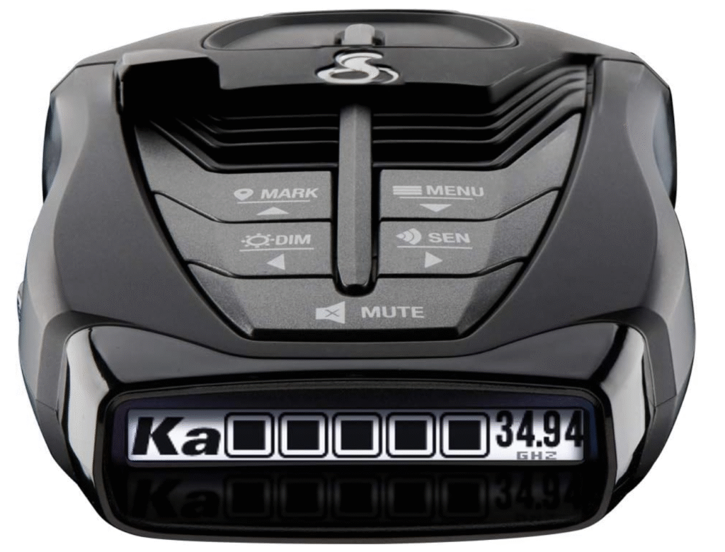 Close-up of Cobra RAD 480i radar detector controls including menu, sensitivity, mute, and OLED Ka-band display.