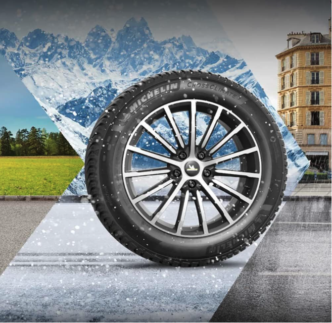 MICHELIN CrossClimate2 tire displayed in a mixed-weather scene with mountains, snow, and clear roads to represent year-round performance.