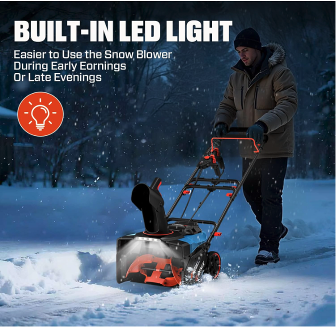 Man clearing snow at night with the SENIX 40V cordless snow blower, showing the built-in LED headlight illuminating the path.