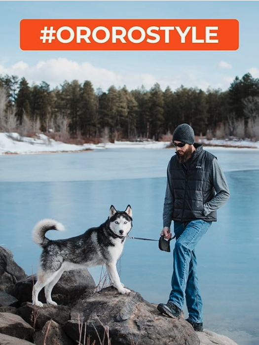 Person wearing ORORO heated vest outdoors in cold weather with dog