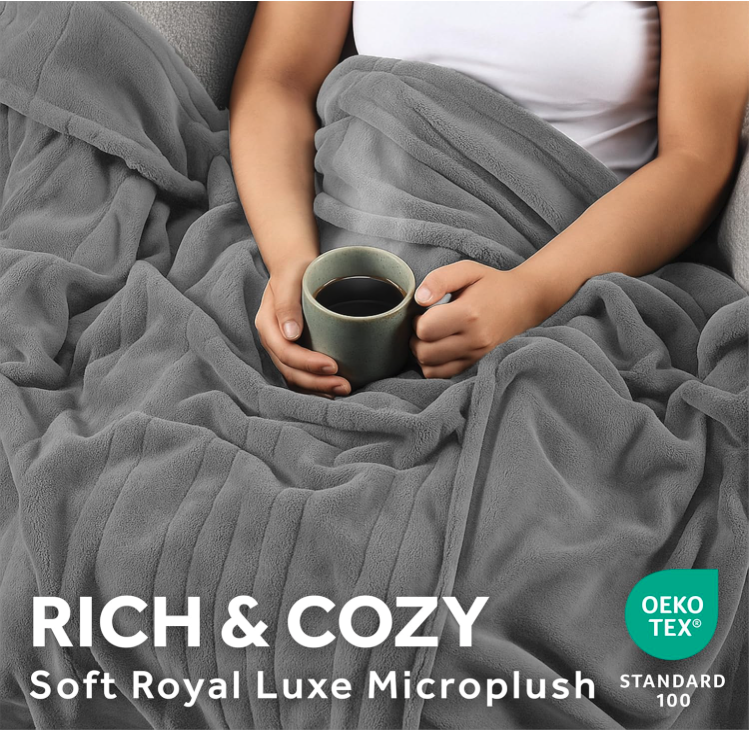 Soft microplush Sunbeam Heated Blanket used while relaxing on a couch with a warm drink